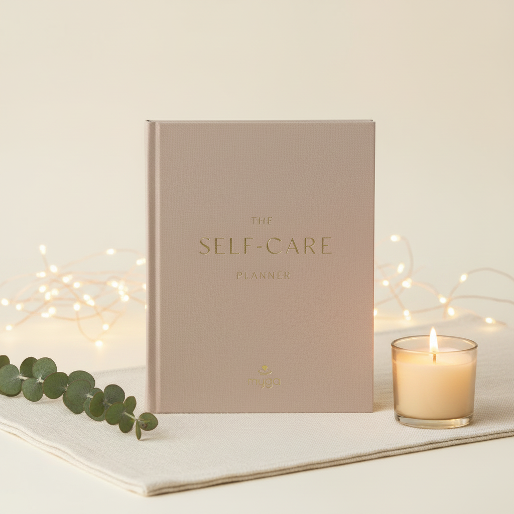 Myga The Self-Care Planner – styled product image with candle, eucalyptus and warm fairy light glow
